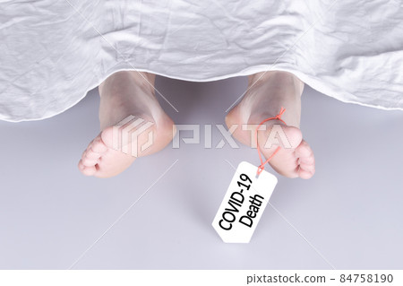 Body with toe tag on white Body with toe tag on white 84758190