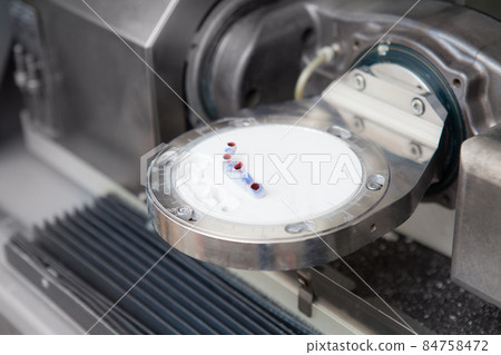 Dentist technician milling machine. Apparatus for carving of dental crowns. Milling dental system with computer control. Laboratory milling cutter for dental work. Cutting plastic crowns from a plate 84758472