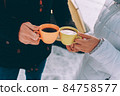 Two cups of tea in the hands of loving couple. winter theme 84758577