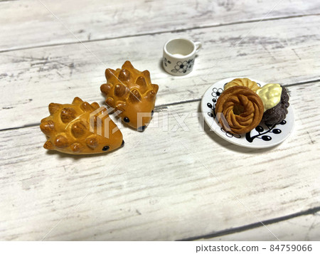 Tea time with two hedgehog breads and donuts Tea time with two hedgehog breads and donuts 84759066