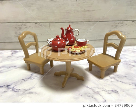 Enjoyable tea time with cute red tea set and cookies Enjoyable tea time with cute red tea set and cookies 84759069
