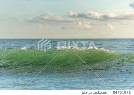 Green wave on a sandy ocean beach. Atlantic coast near Les Sables d'Olonne. France, Europe. Green wave on a sandy ocean beach. Atlantic coast near Les Sables d'Olonne. France, Europe. 84761978