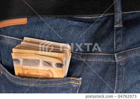 Euro banknotes in the pocket of jeans. Close up. To spend money Euro banknotes in the pocket of jeans. Close up. To spend money 84762073