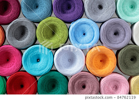 Skeins of colorful threads for needlework. 84762119