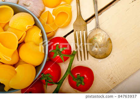 Italian snail lumaconi pasta with tomatoes 84763937