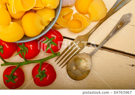 Italian snail lumaconi pasta with tomatoes 84763967