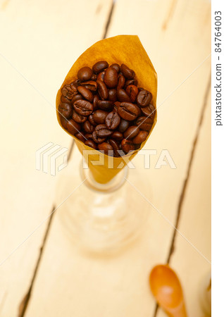 espresso coffee beans on a paper cone 84764003