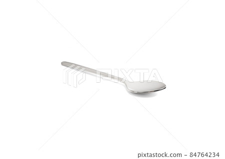 Clean shiny metal spoon isolated on white. Stainless steel small kitchen dessert teaspoon cut close up. Tablespoon. Kitchen utensils concept. 84764234
