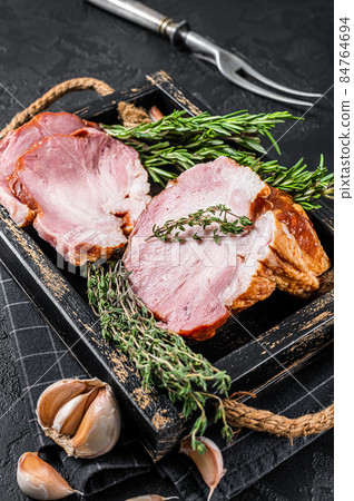 Sliced Smoked gammon - pork shoulder meat with herbs. Black background. Top view 84764694