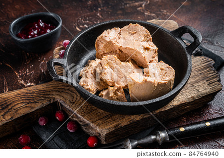 Franch Foie gras duck liver pate with lingonberry marmalade. Dark background. Top view 84764940
