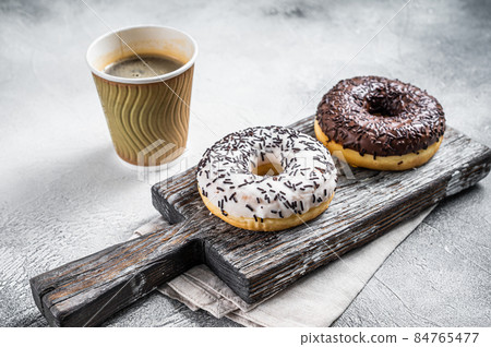 Fresh Chocolate artisan donuts and take away coffee. White background. Top view 84765477