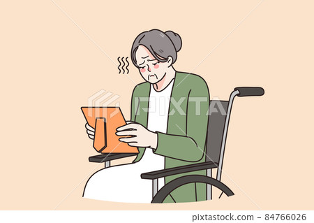 Sad senior granny in wheelchair look at family picture Sad senior granny in wheelchair look at family picture 84766026