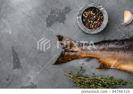 Smoked whole salmon, on gray stone table background, top view flat lay, with copy space for text Smoked whole salmon, on gray stone table background, top view flat lay, with copy space for text 84766320