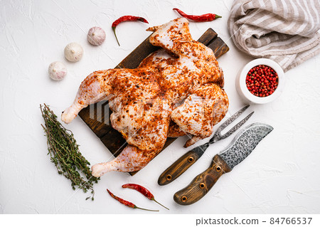 Raw tobacco chicken, on white stone table background, top view flat lay Raw tobacco chicken, on white stone table background, top view flat lay 84766537