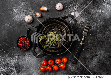 Lamprey with herbs, on black wooden table background, top view flat lay 84766539