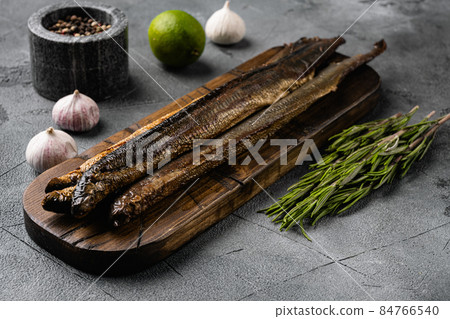 Smoked lamprey , on gray stone table background Smoked lamprey , on gray stone table background 84766540
