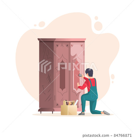 Restoration of old furniture. Craftsman repair vintage battered antique cupboard with cracks 84766871