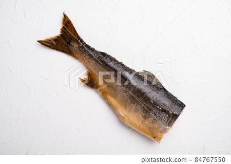 Whole hot smoked fish, on white stone table background, top view flat lay, with copy space for text Whole hot smoked fish, on white stone table background, top view flat lay, with copy space for text 84767550