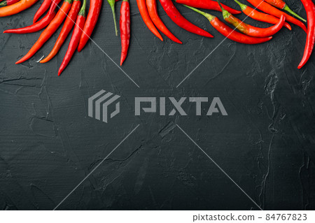 Hot Red thai pepper, on black stone background, top view flat lay, with copy space for text Hot Red thai pepper, on black stone background, top view flat lay, with copy space for text 84767823