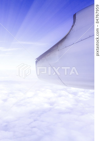 A wonderful view from the window of an airplane: Blue-purple sky and light 84767959
