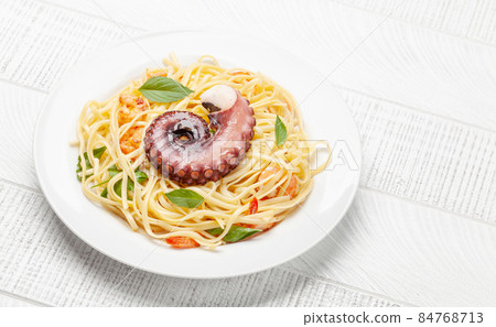 Seafood pasta with octopus and shrimps 84768713