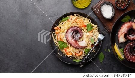 Seafood pasta with octopus and shrimps 84768714