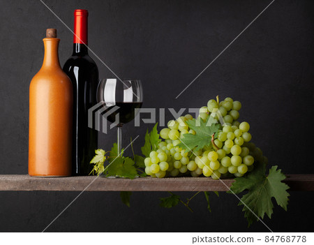 White grape, bottles and red wine glass 84768778