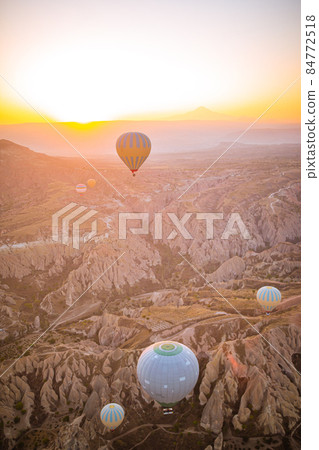 Bright hot air balloons in sky of Cappadocia, Turkey Bright hot air balloons in sky of Cappadocia, Turkey 84772518