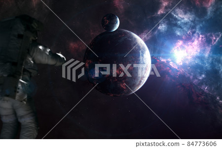 Inhabited planets of deep space. Astronaut out of focus Inhabited planets of deep space. Astronaut out of focus 84773606