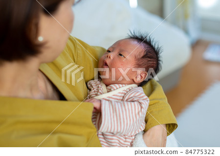 Breastfeeding mom and 1 month old baby Breastfeeding mom and 1 month old baby 84775322