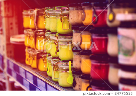 jars with sauces in the store 84775555