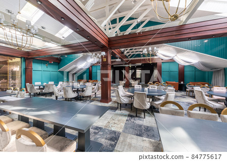 expensive modern restaurant interior with designer furniture and Emerald walls, large mahogany beams expensive modern restaurant interior with designer furniture and Emerald walls, large mahogany beams 84775617