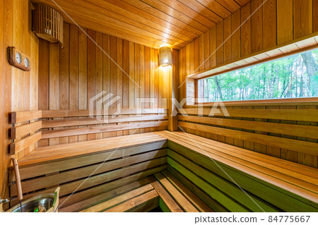 sauna made of natural wood with a large panoramic window sauna made of natural wood with a large panoramic window 84775667