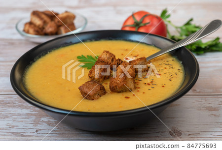 Merzhimek chorbasy - Turkish red lentil soup in a bowl. 84775693
