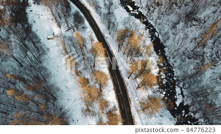 Aerial high angle view of mountain road. Aerial high angle view of mountain road. 84776223