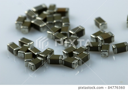 SMD ceramic capacitors on white background. Electronic components. 84776360