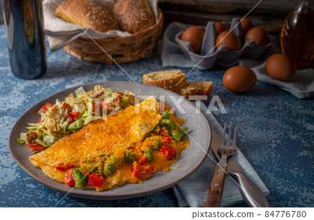 Egg omelette with peppers 84776780
