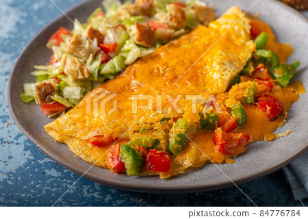Egg omelette with peppers 84776784