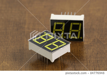 Digital seven segment display on wooden background Digital seven segment display on wooden background 84776948