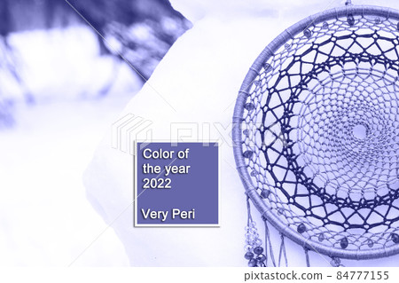 Handmade dream catcher with feathers threads and beads rope in very peri trendy color of the year 2022. Handmade dream catcher with feathers threads and beads rope in very peri trendy color of the year 2022. 84777155