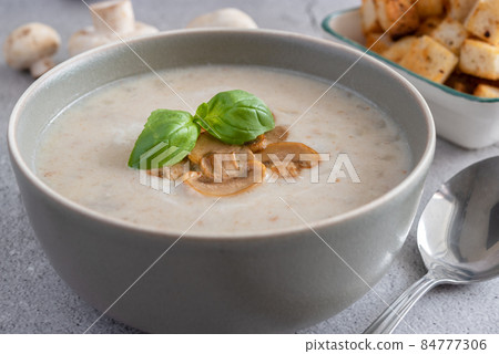 A close-up of a bowl of mushroom soup. A close-up of a bowl of mushroom soup. 84777306