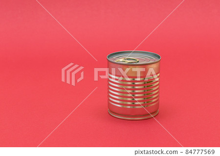Unopened Tin Can with Blank Edge on Red Background 84777569