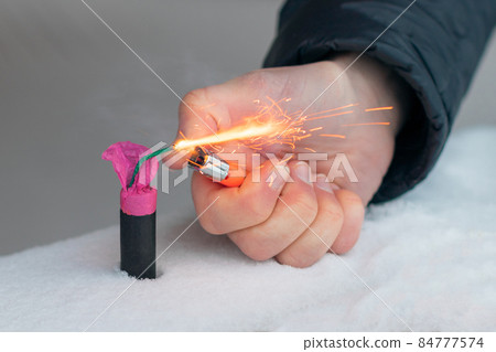 Guy Sets Fire to the Flash Noise Firecracker Outdoors 84777574