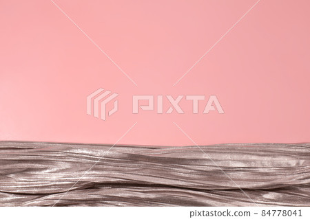 Shiny silver fabric on pink background. Free space, copy space for your text and design. Events, celebrations, Christmas, New Year. Trendy backdrop. Shiny silver fabric on pink background. Free space, copy space for your text and design. Events, celebrations, Christmas, New Year. Trendy backdrop. 84778041