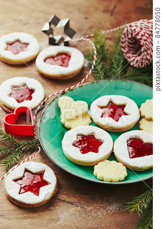 Classic Linzer Christmas Cookies with raspberry or strawberry jam on wooden table Classic Linzer Christmas Cookies with raspberry or strawberry jam on wooden table 84778050