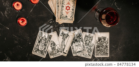 Tarot cards on red background, occult and magic Tarot cards on red background, occult and magic 84778134