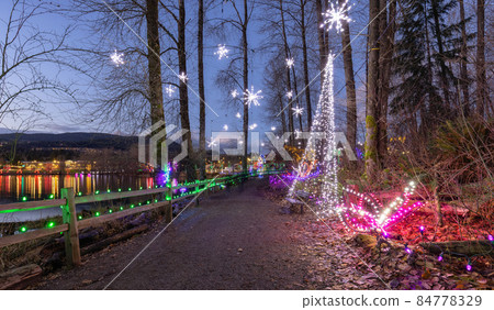 Trail in a park around Lafarge Lake with Christmas Lights. Trail in a park around Lafarge Lake with Christmas Lights. 84778329