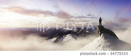 Extreme adventure composite. Man on top of a Rocky Mountain Cliff. Extreme adventure composite. Man on top of a Rocky Mountain Cliff. 84778333