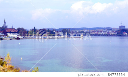 LINDAU, GERMANY - 14 OCT 2015: Lindau harbour promenade on Lake Constance LINDAU, GERMANY - 14 OCT 2015: Lindau harbour promenade on Lake Constance 84778334