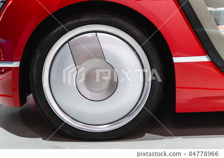 Wheel of a red conceptual sports car, close up 84778966
